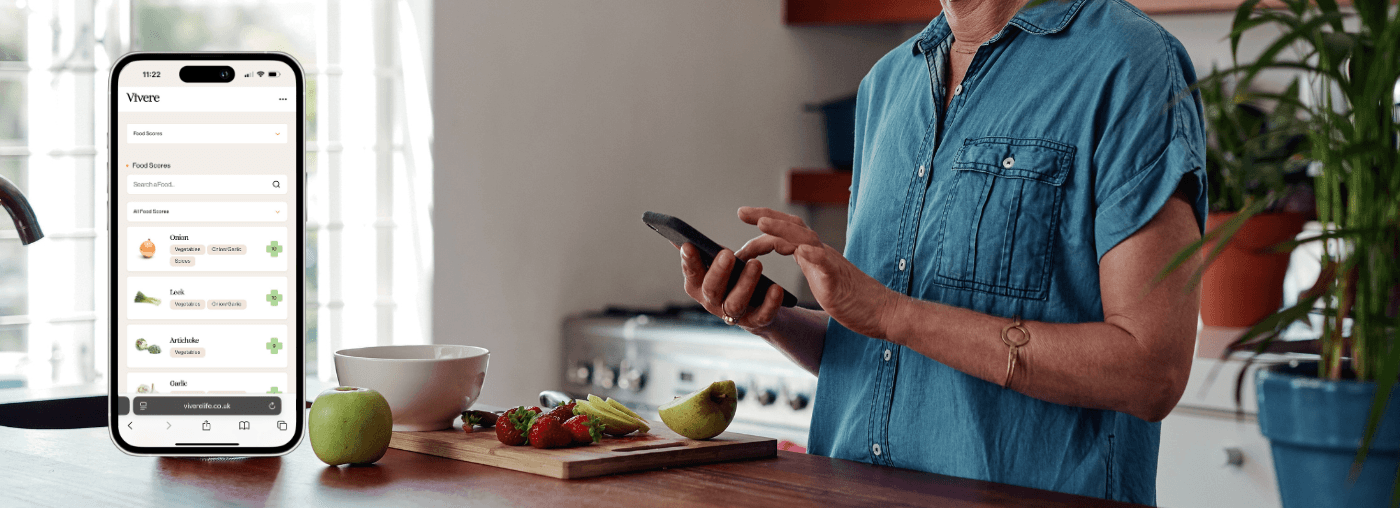 woman on phone on dashboard whilst cooking